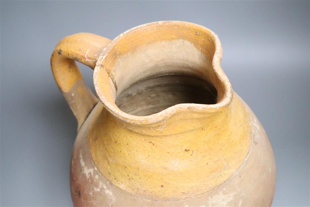 A Verwood earthenware jug, height 34cm